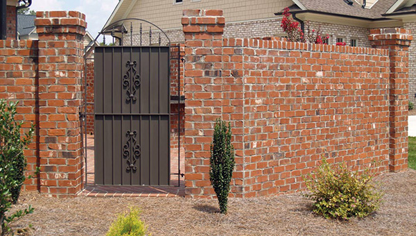 How to Hang a Metal Gate on Brick Wall 